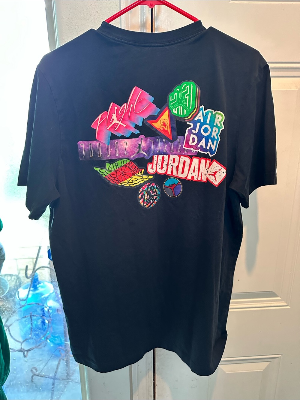 Jordan Black Tee with Multicolor Retro Badge Graphics